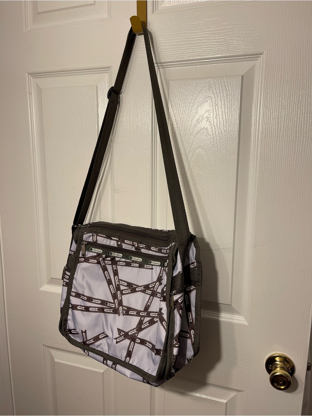 Lesportsac White and Brown Patterned Messenger Bag